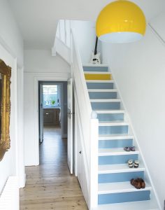 white-hallway-with-painted-stairs